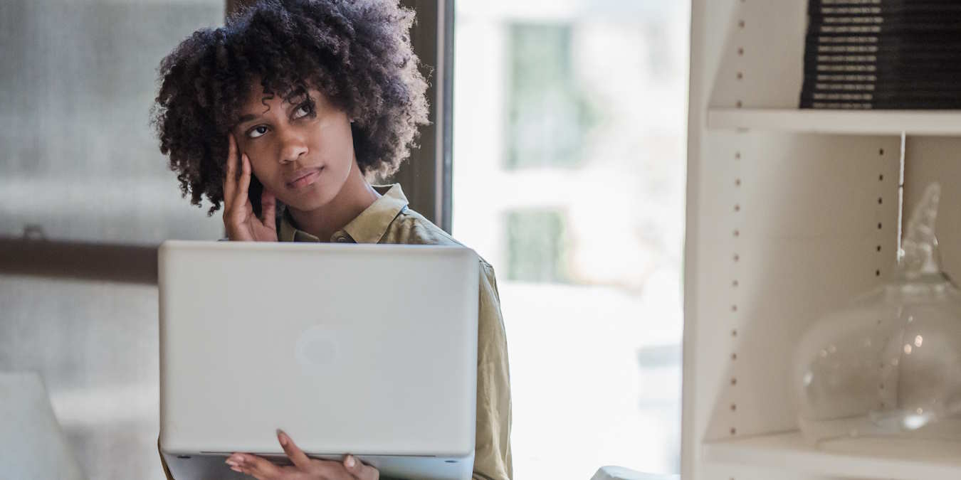 A Woman Holding Laptop