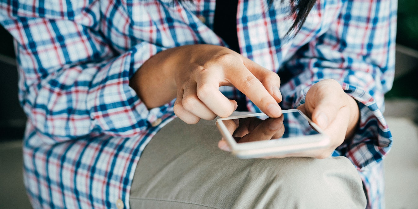 Person Taking Notes On Android Phone