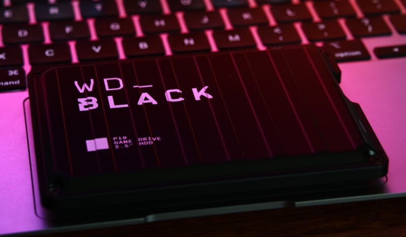 WD Black P10 Game Drive 2TB Black external hard drive on a laptop in pink lighting