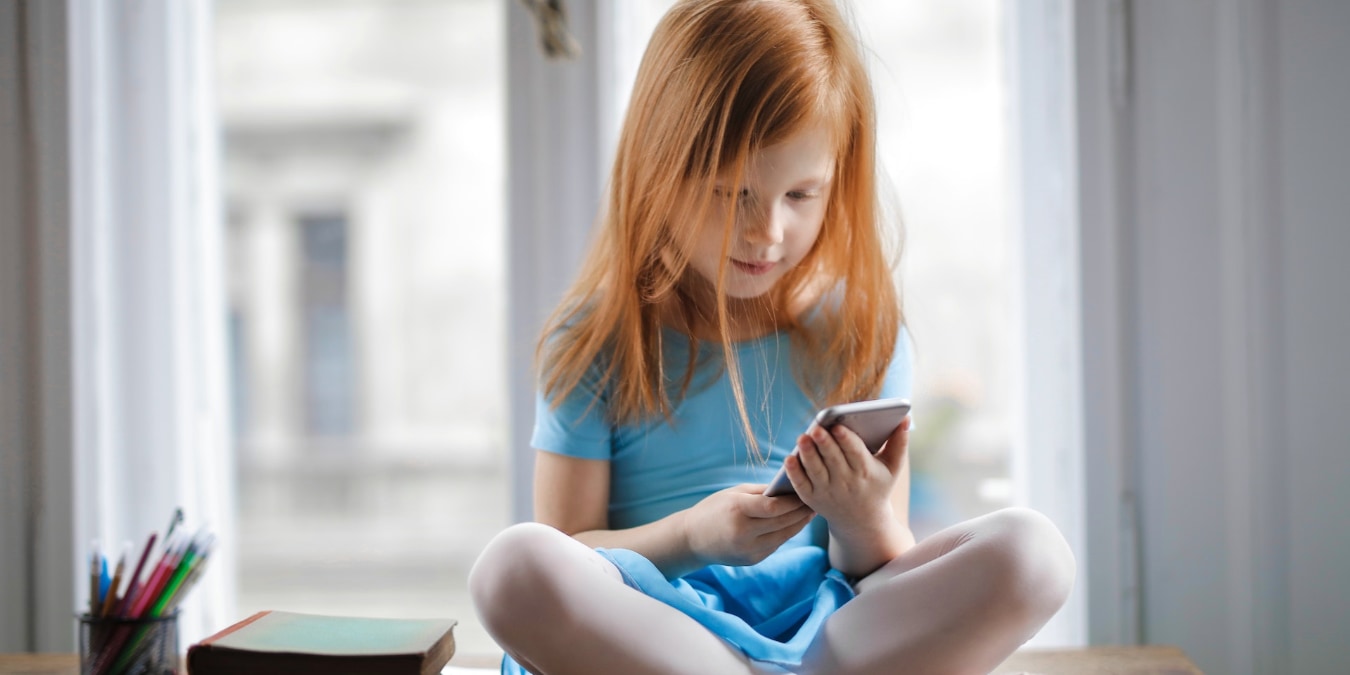 Child Using A Phone