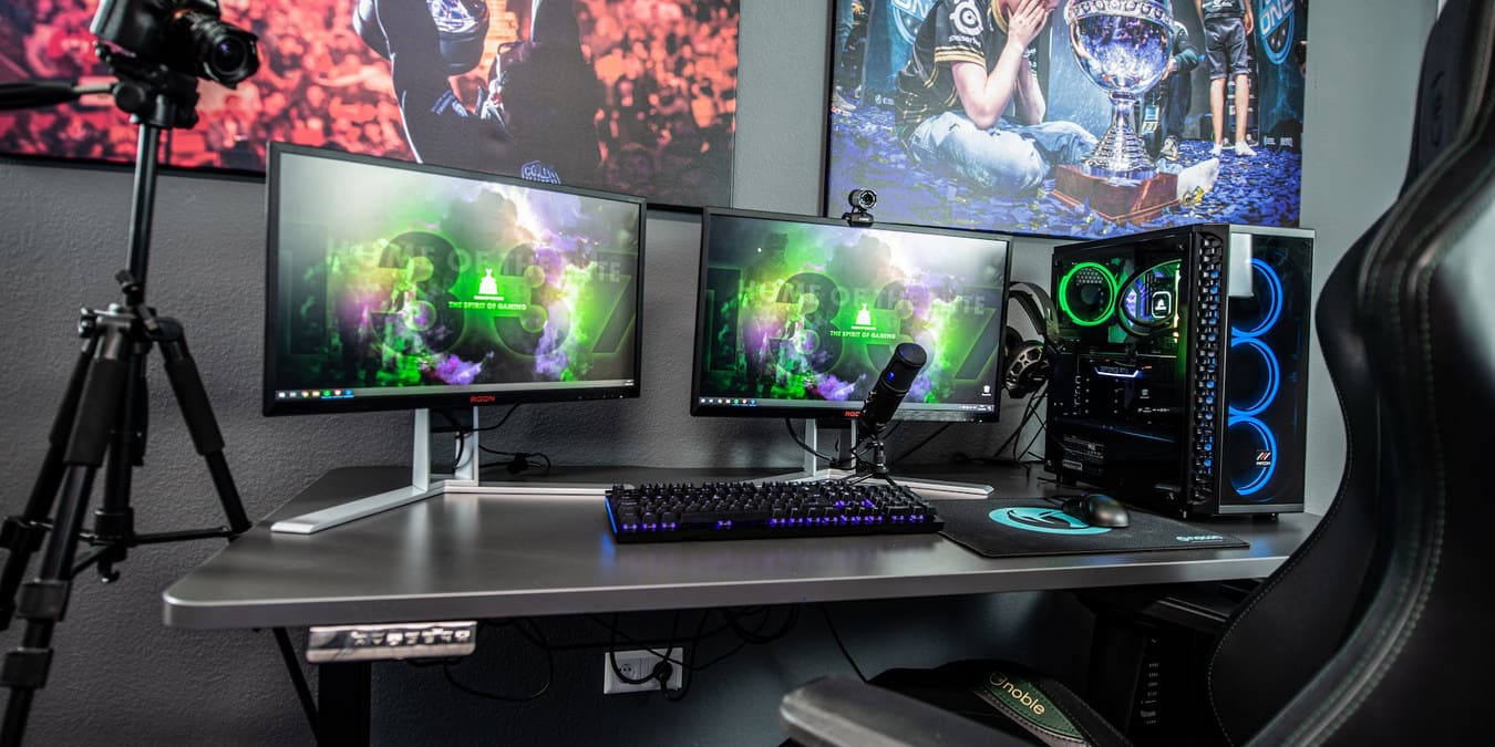 Two black monitors on a table